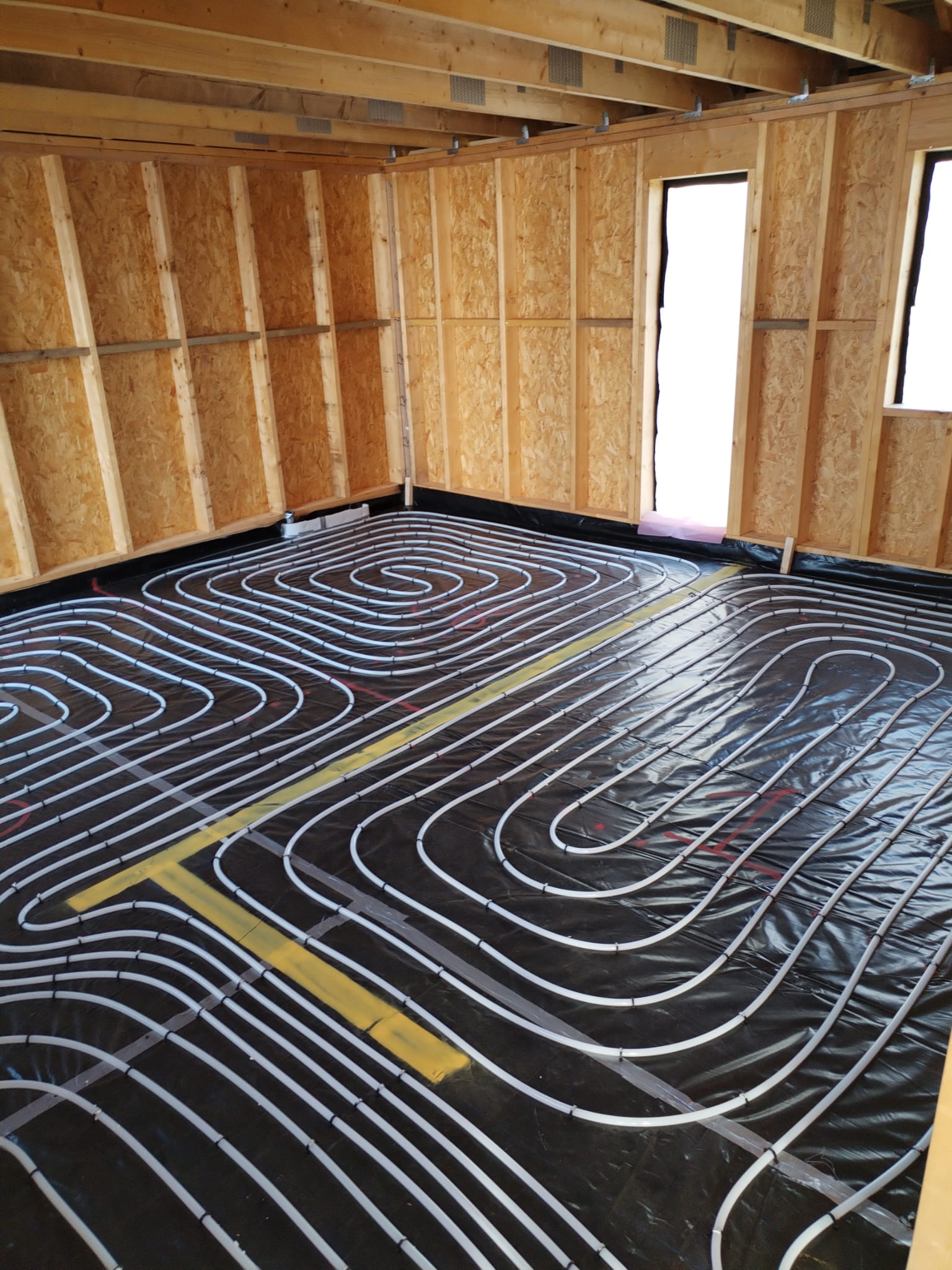 Underfloor Heating installation using staple onto insulation method