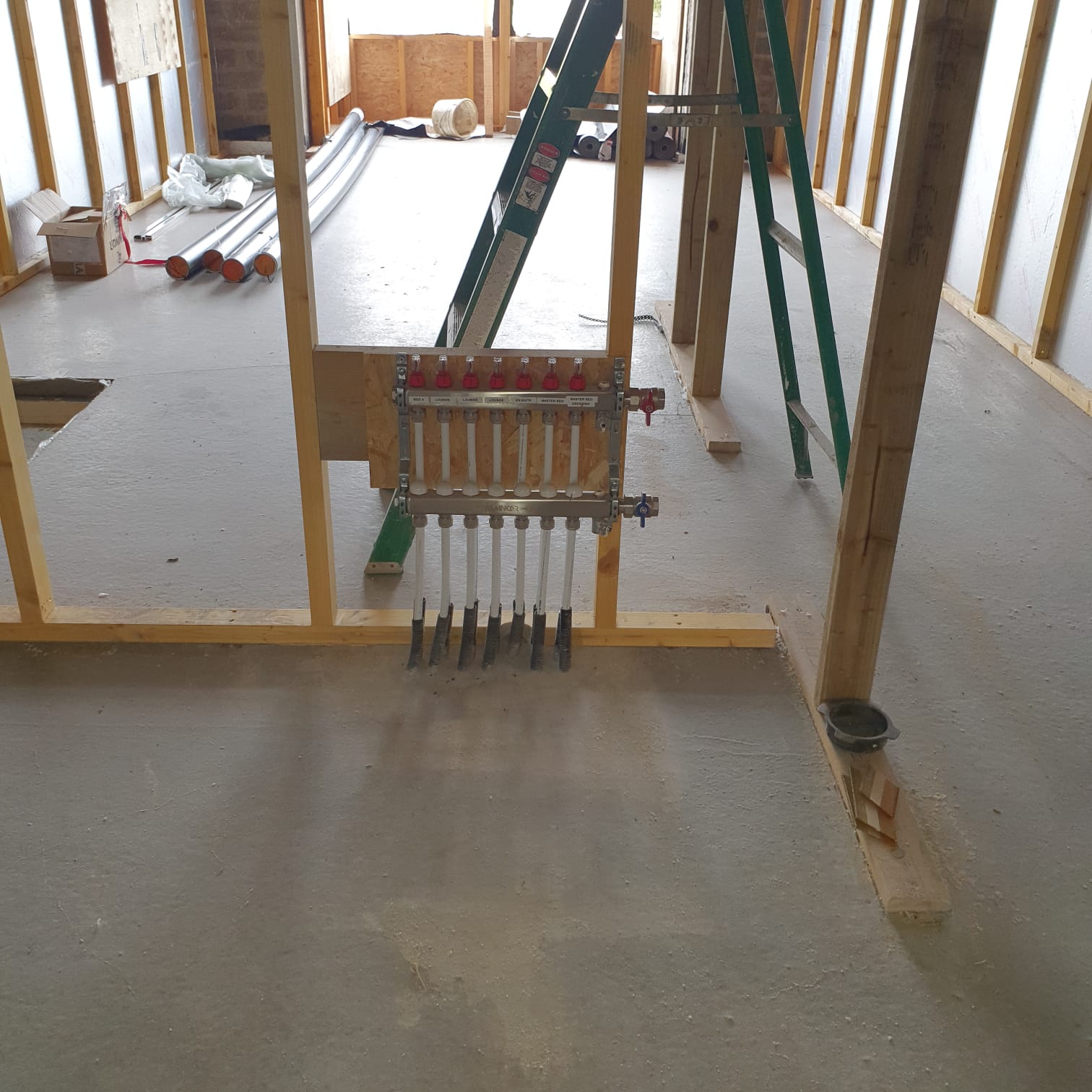After the screed has been poured showing the underfloor heating manifold